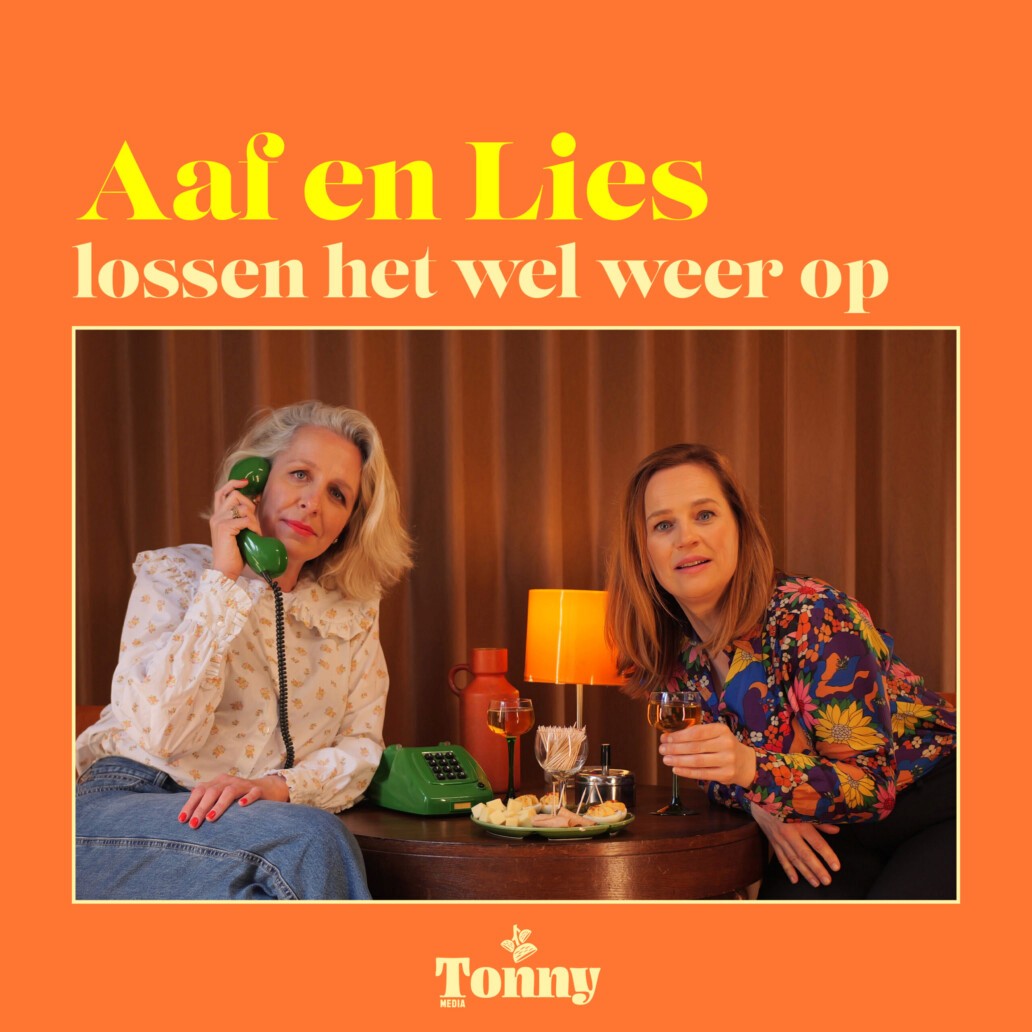 Two people sitting at a table with drinks.