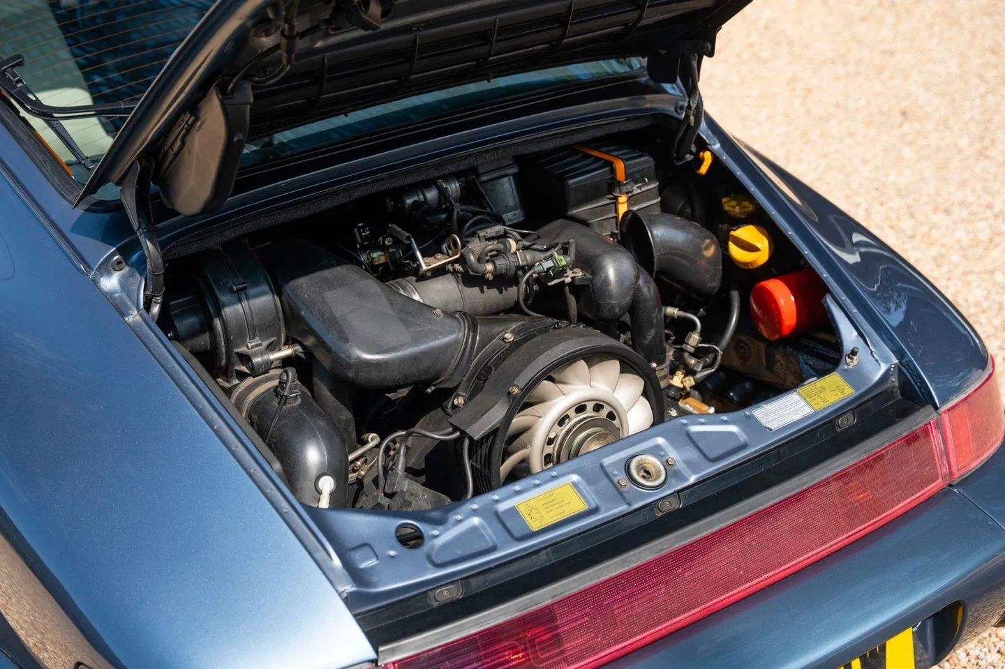Engine bay from the rear quarter with oil filler and tail light
