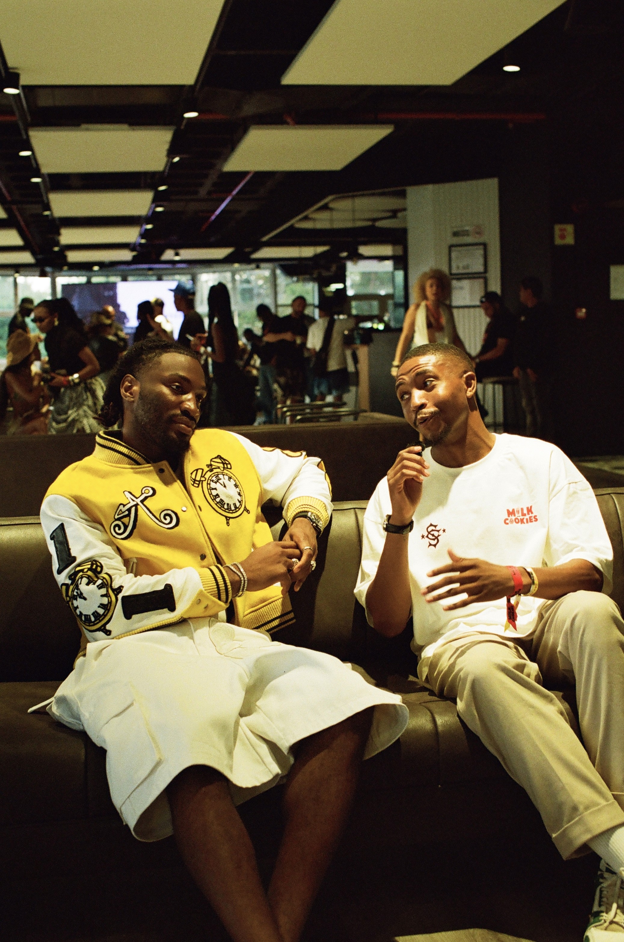 A fast black sports car races down the highway.
