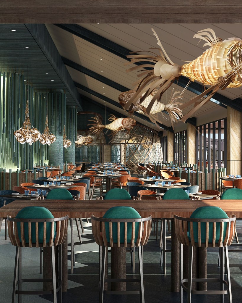 Interior view of a modern restaurant featuring wooden furniture, vibrant seating, and artistic fish-shaped light fixtures.