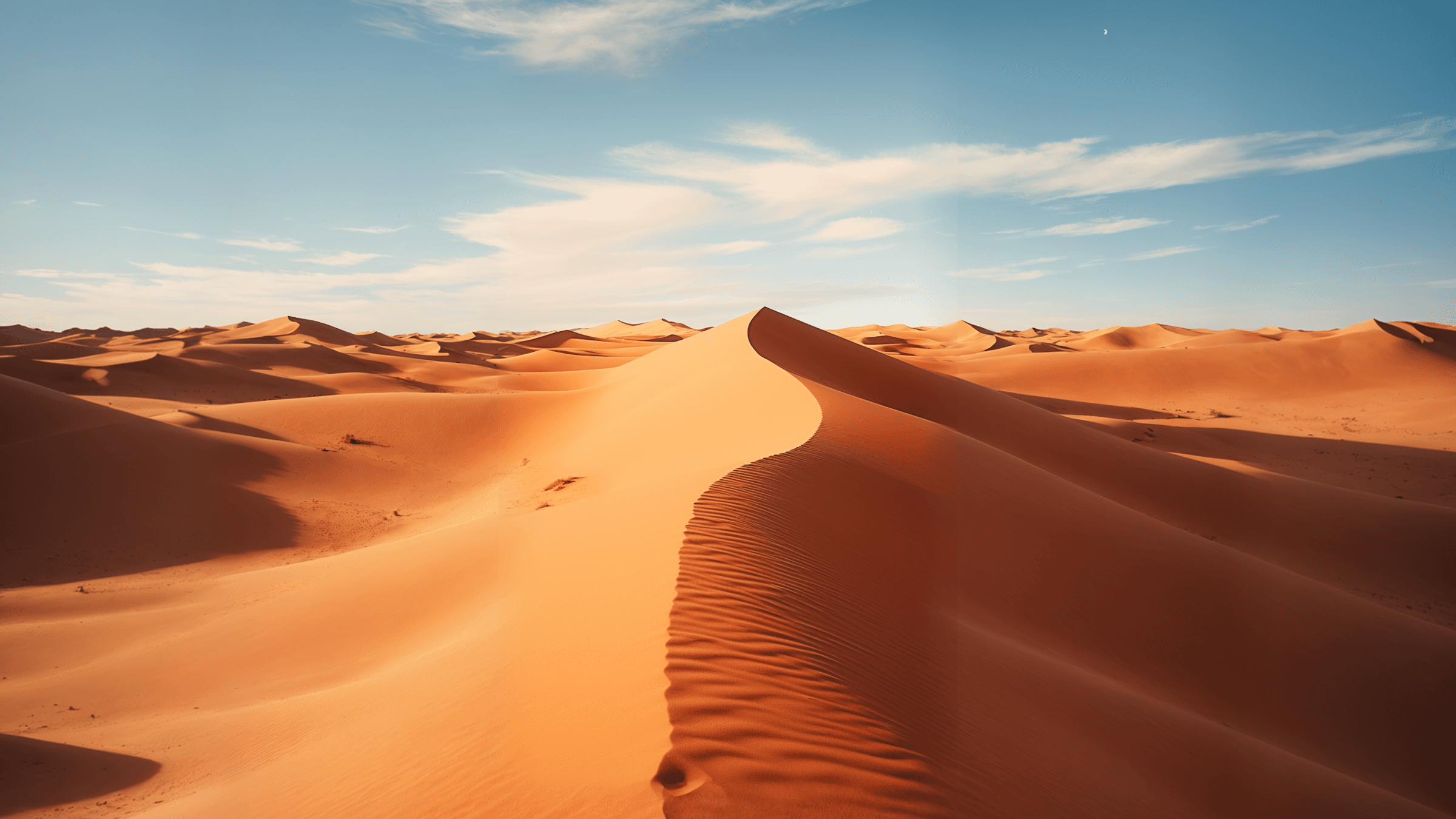 Majestic sandstone cliffs in golden light, showing the natural beauty of AlUla’s desert landscape.