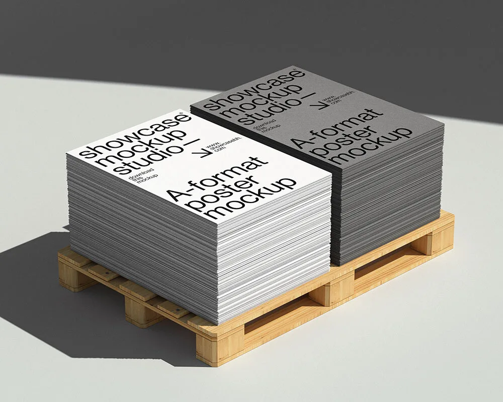 Mockup of stacked A-format posters in white and gray, placed on a wooden pallet. The clean, minimal design and sharp lighting create a professional and industrial presentation, perfect for showcasing print materials.