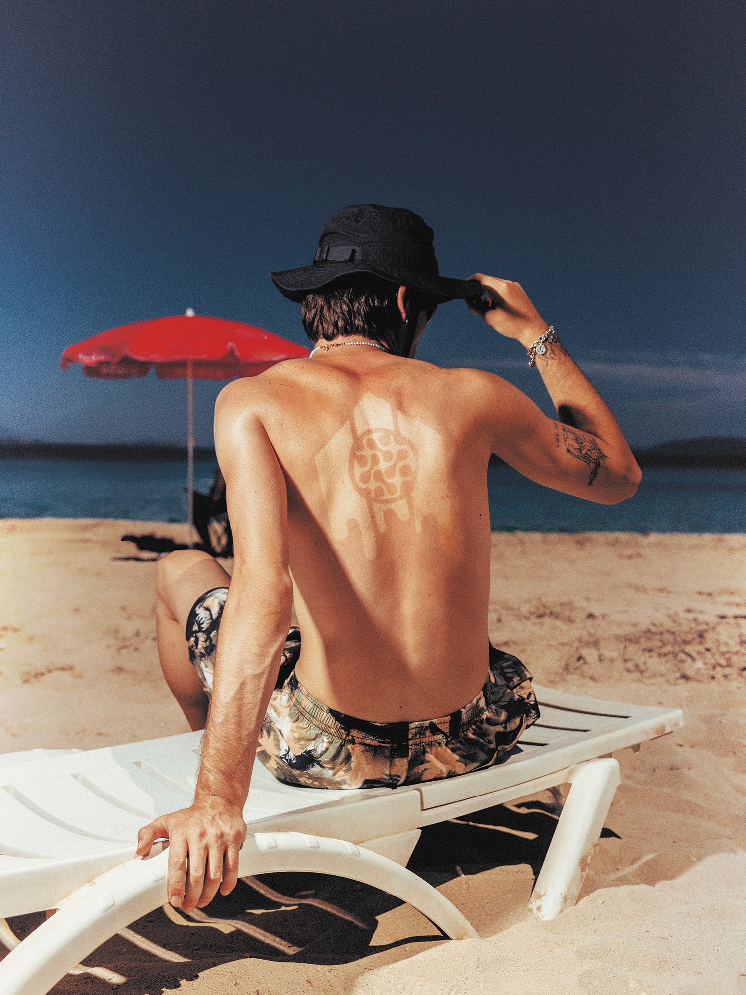 Streetside billboard with flyposters of the Batch.Works brand and illustrations