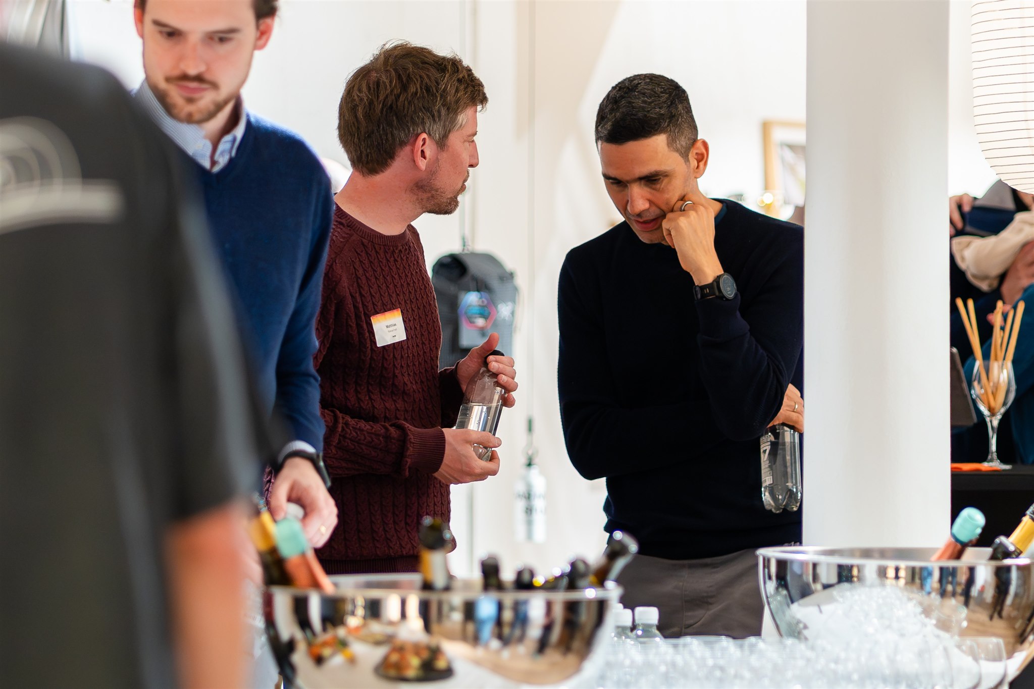 Guests at catering area during networking event Zurich