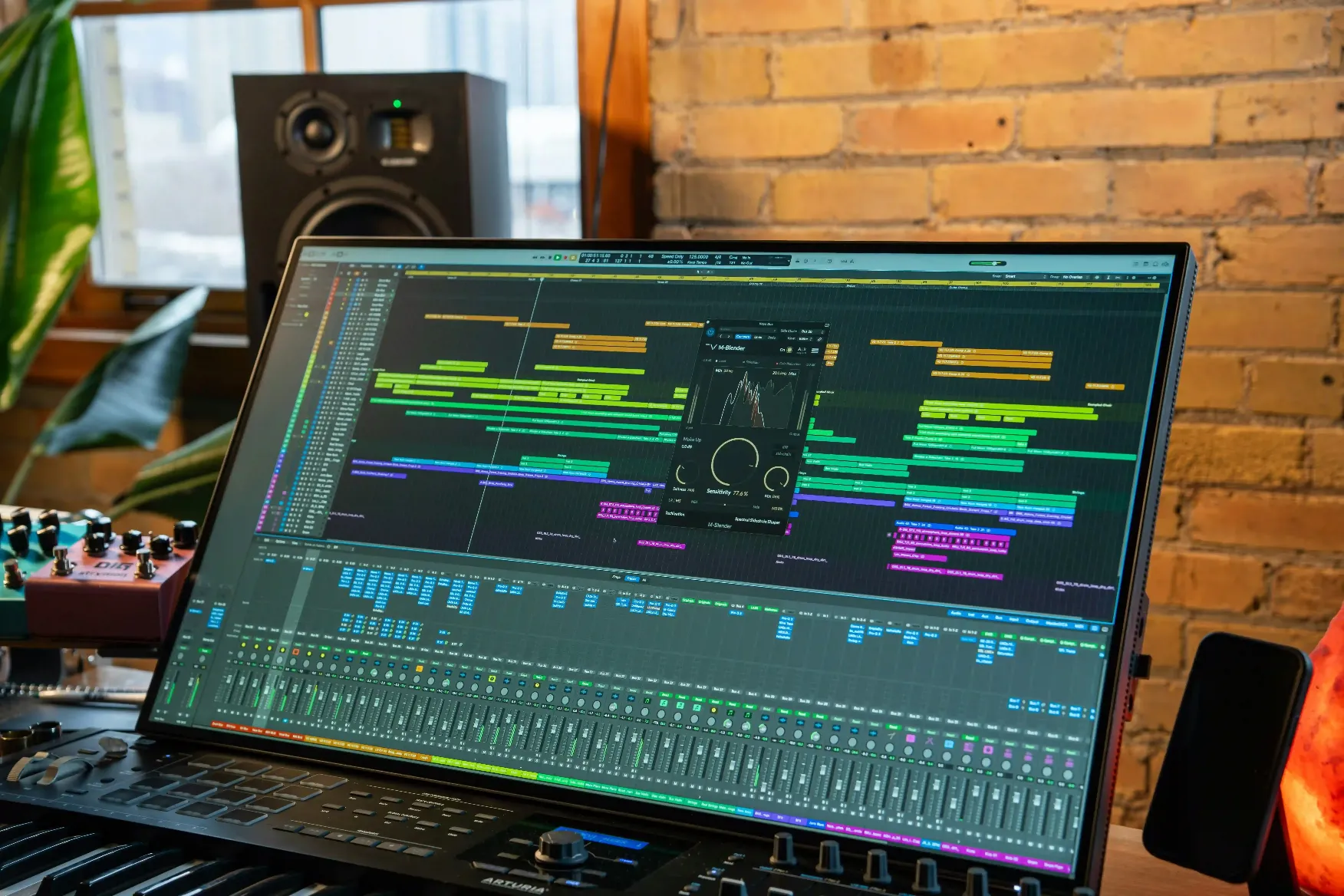 a laptop computer sitting on top of a keyboard