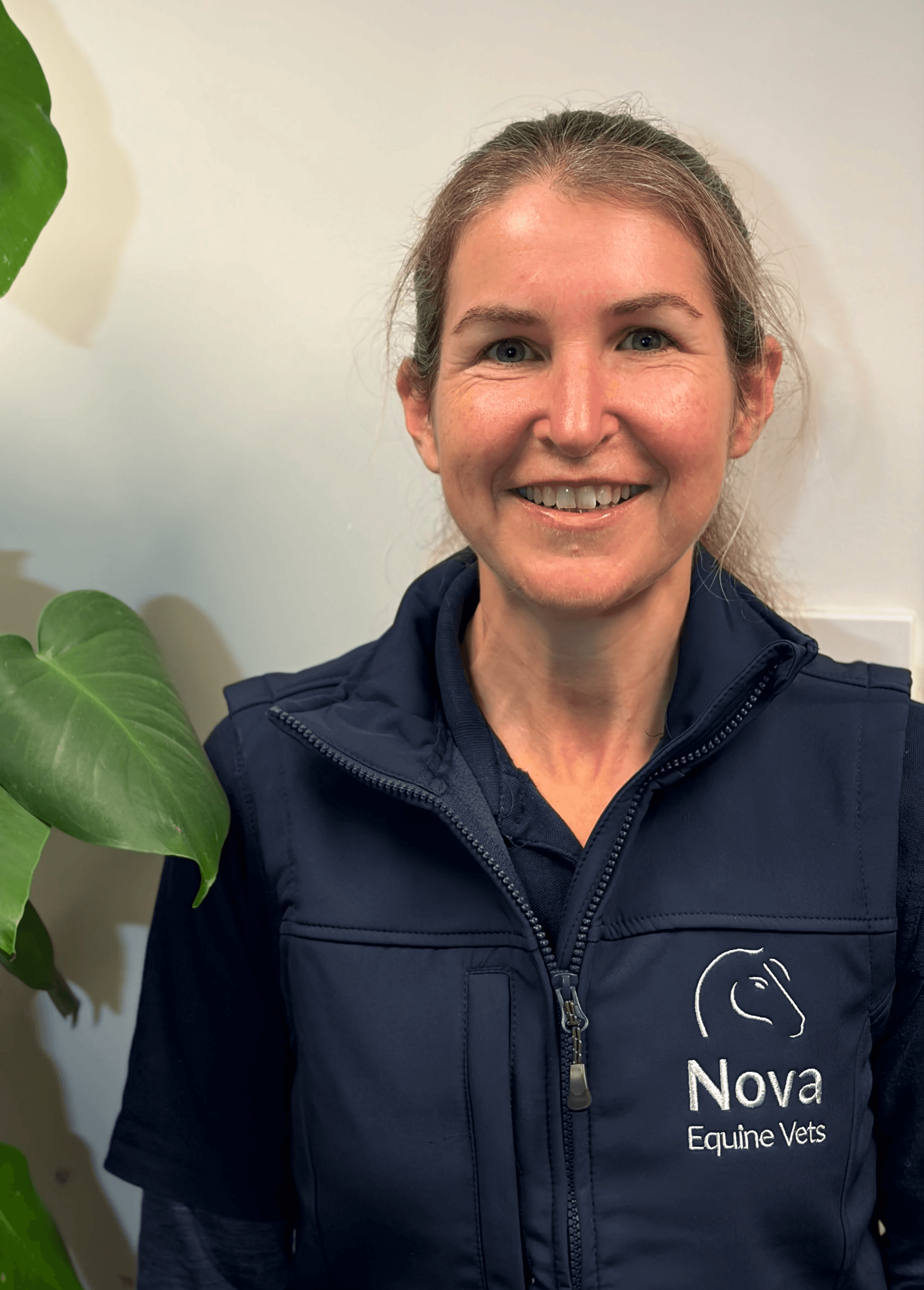 woman in red cardigan smiling