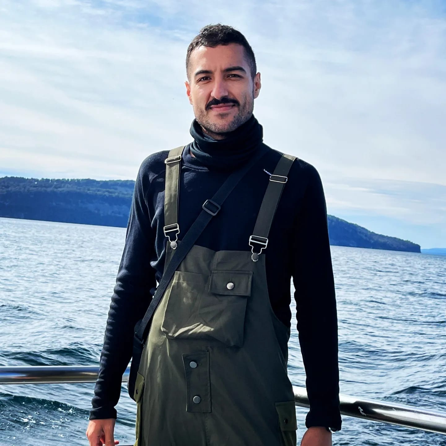 A happy customer smiling wearing orange headband