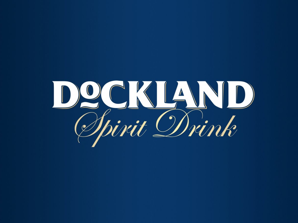 Rustic cabin in a golden field at sunset