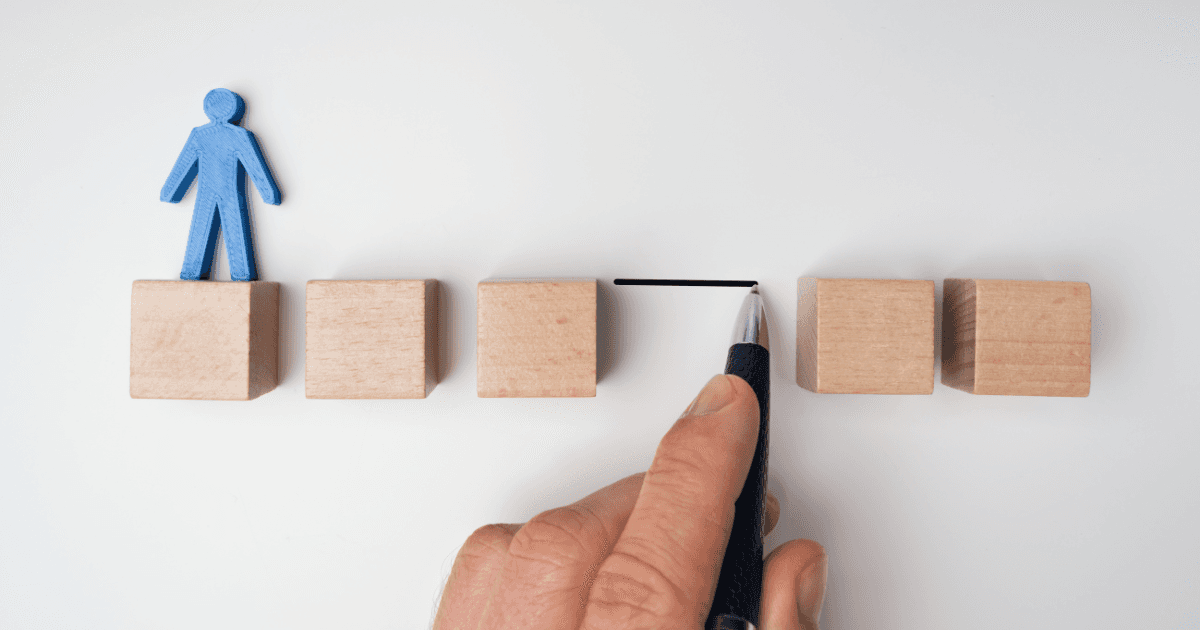 square wood clocks, outline of body on the first block, horizontal line connecting one block to the rest