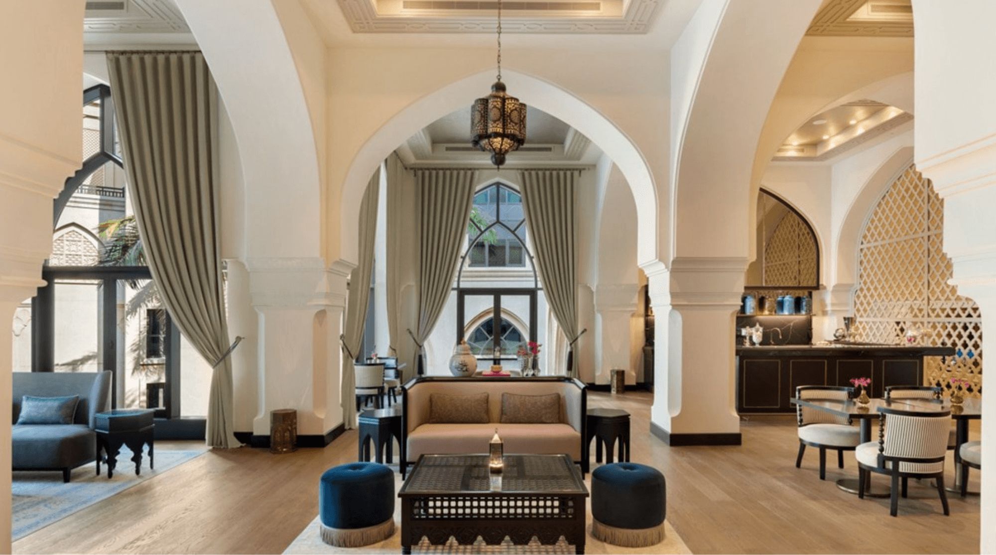 Al Bayt at the Palace Downtown featuring a grand and fancy design with elegant seating, sofas, and decorations.