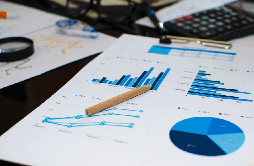 Financial charts and pencil representing accurate small business bookkeeping and reporting by BM Bookkeeping