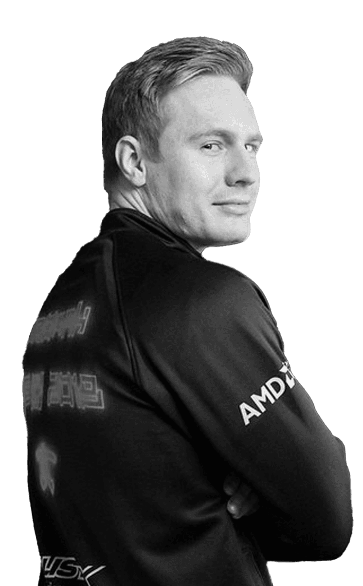 Professional woman in a suit standing in an office setting.