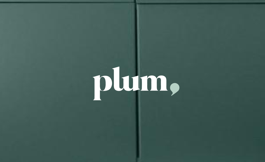 Plum logo with a comma next to it.