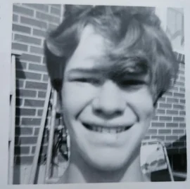 a man holding a cocktail