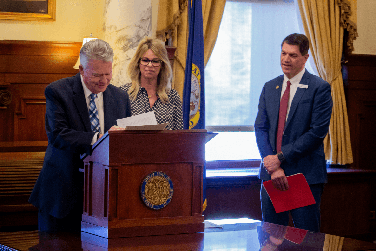 Gov. Brad Little signing SB 1227, guidance for AI in schools, with Superintendant for Public Instruction Debbie Critchfield and Sen. Kevin Cook, R-Idaho Falls on March 26, 2026 (Joel Hroma for CBS2)