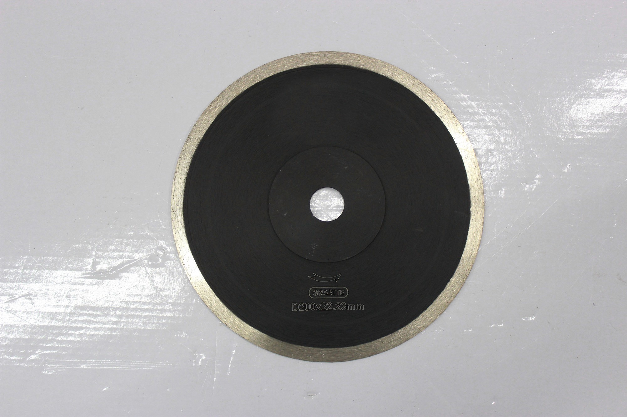 Sintered continuous rim blade with black coating and clear size marking.