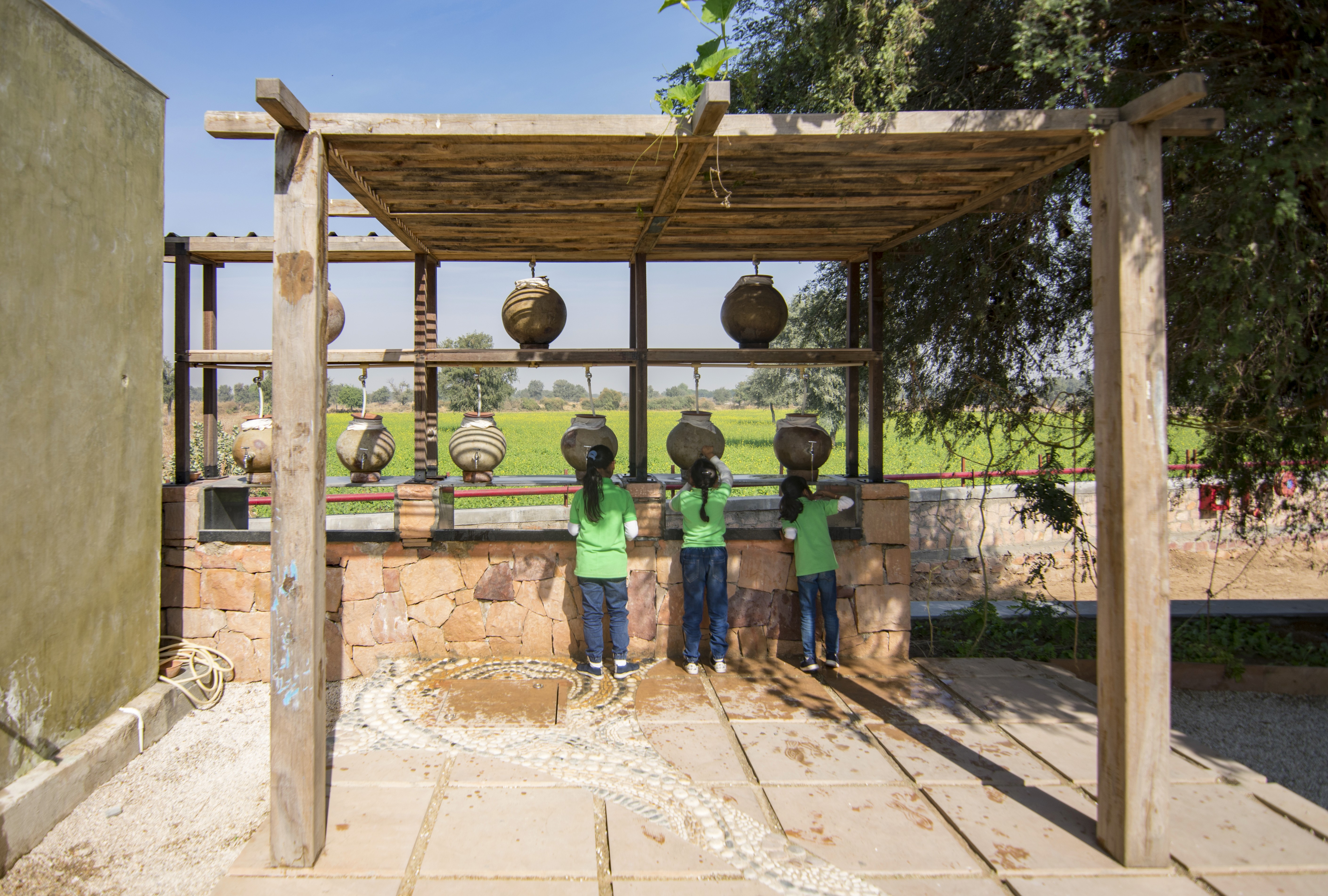 A student stands with a backpack on, ready for school