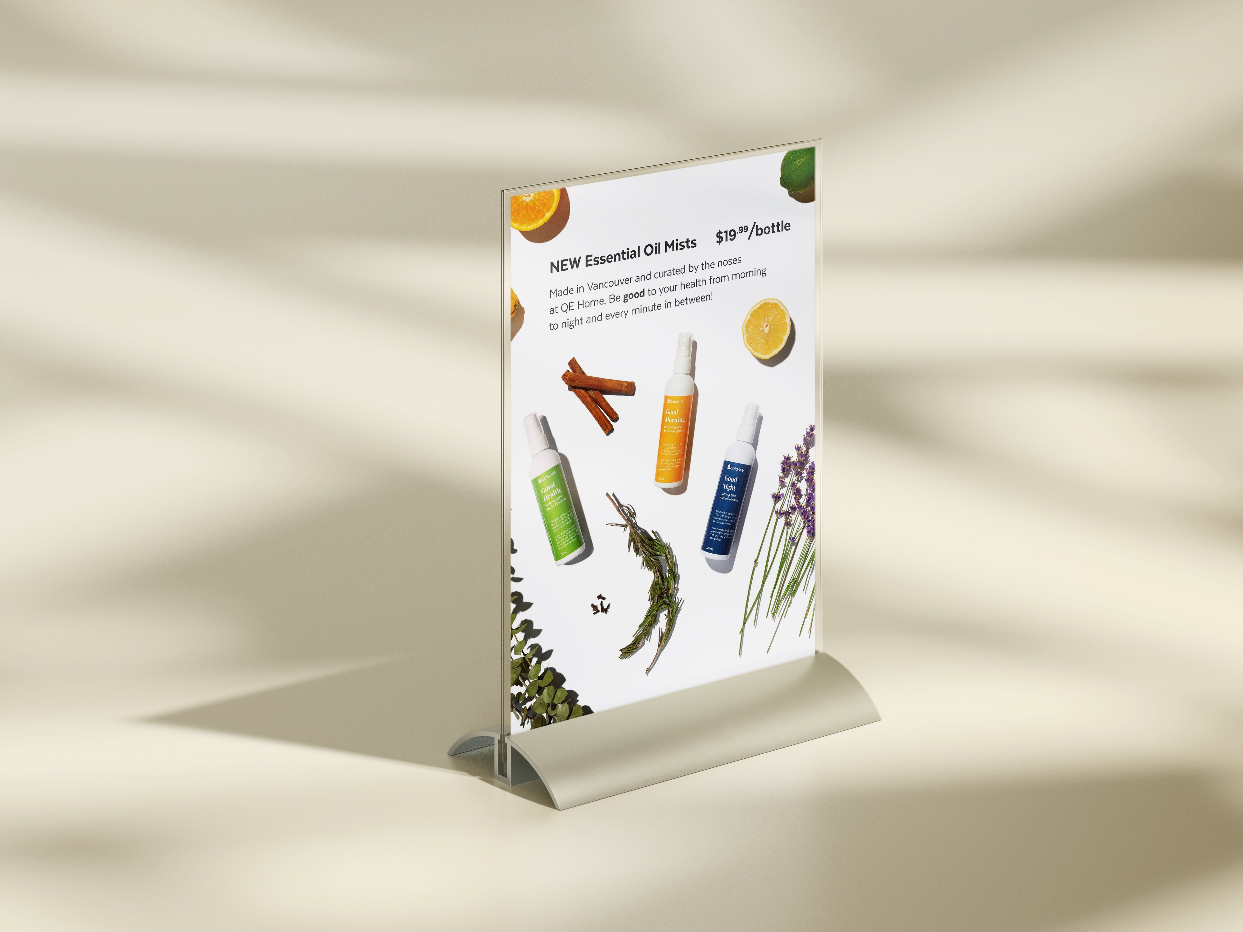 QE Home cash desk sign promoting the new Essential Oil Mists product launch