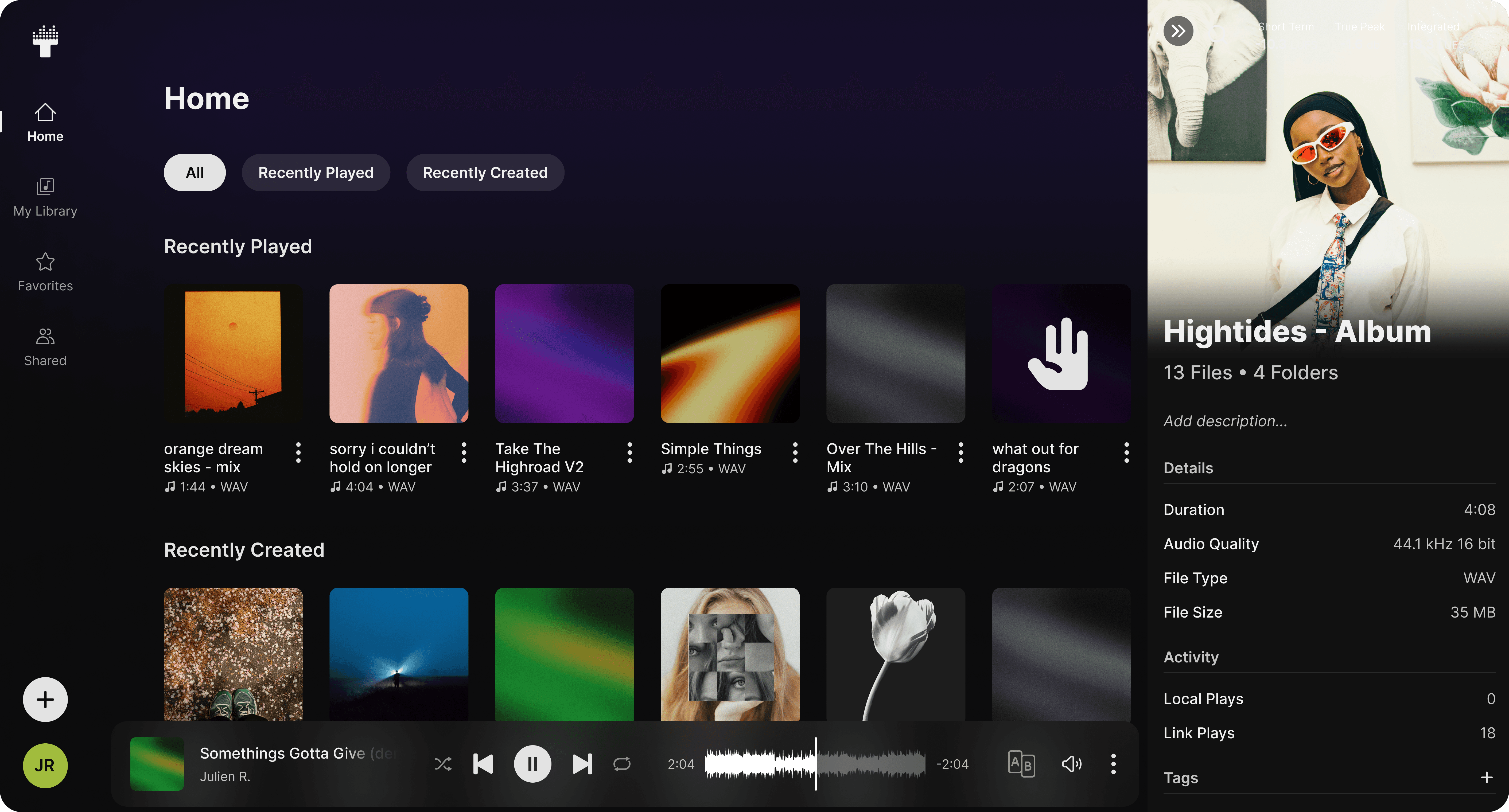 Traklist Web App displaying organized music files and artwork with an audio player.