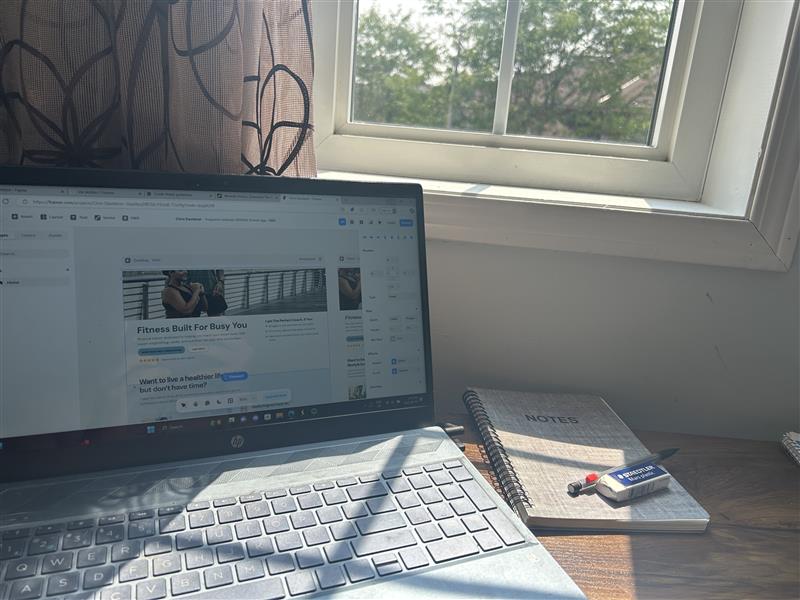 Photo of a laptop screen displaying a UI of website