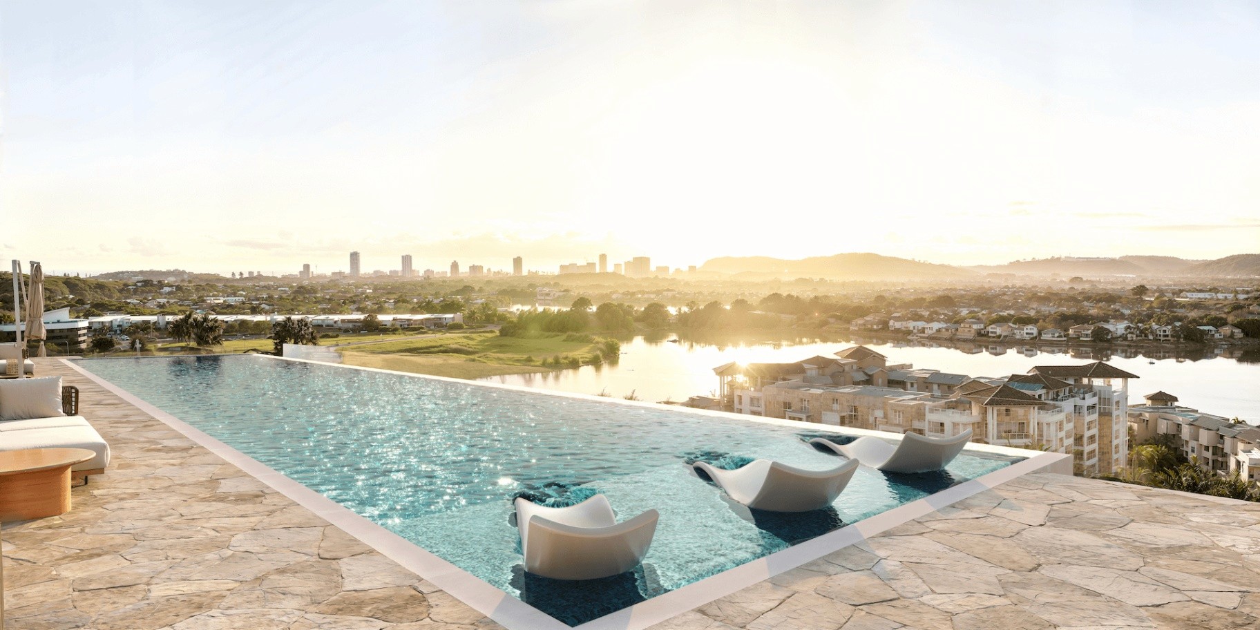 Infinity rooftop pool at COMO Varsity Lakes with lake and skyline views, resort-style apartment living Gold Coast