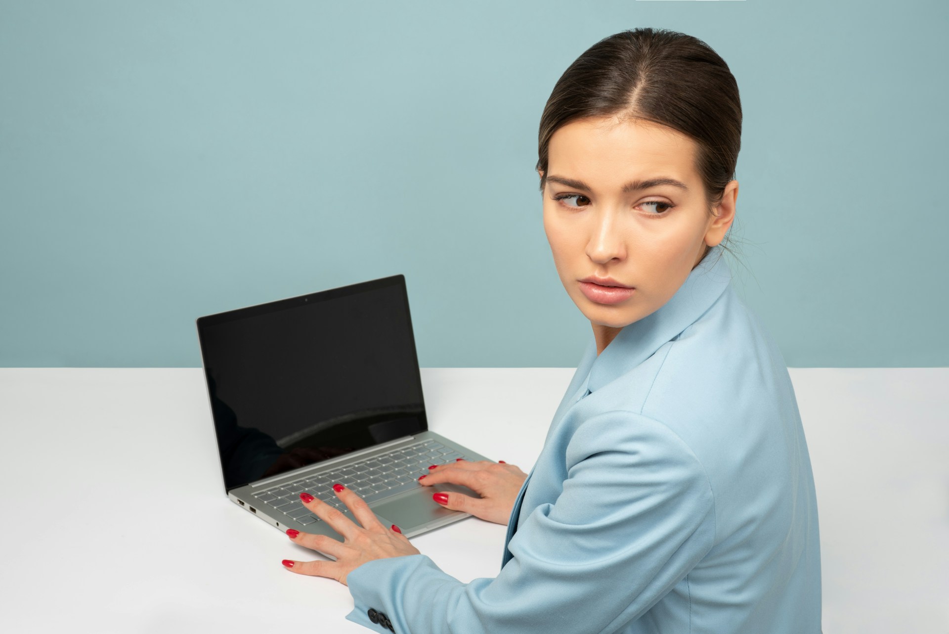 woman on laptop - Unprofessional Email Address Examples
