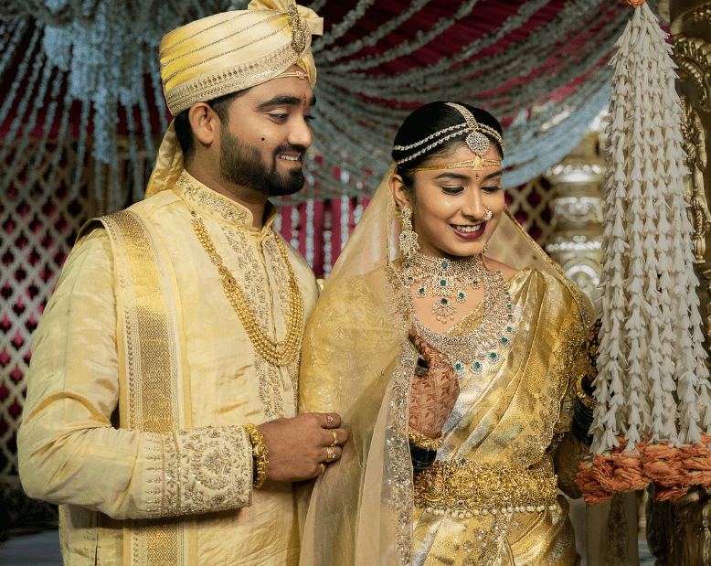 Silhouette of a person standing among tall redwood trees.