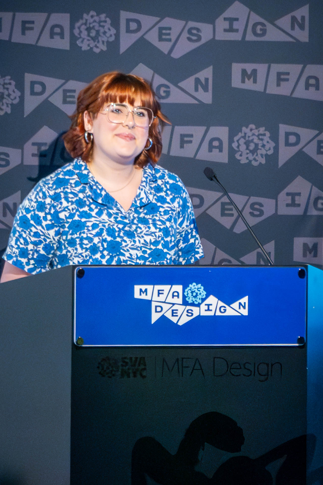 student at a podium giving a presentation