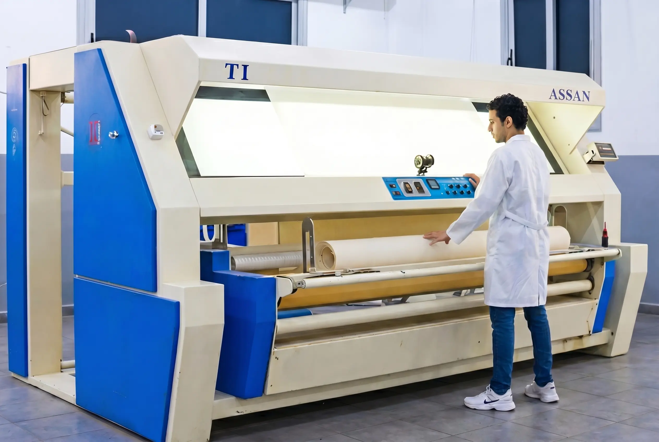 Industrial fabric processing machine.