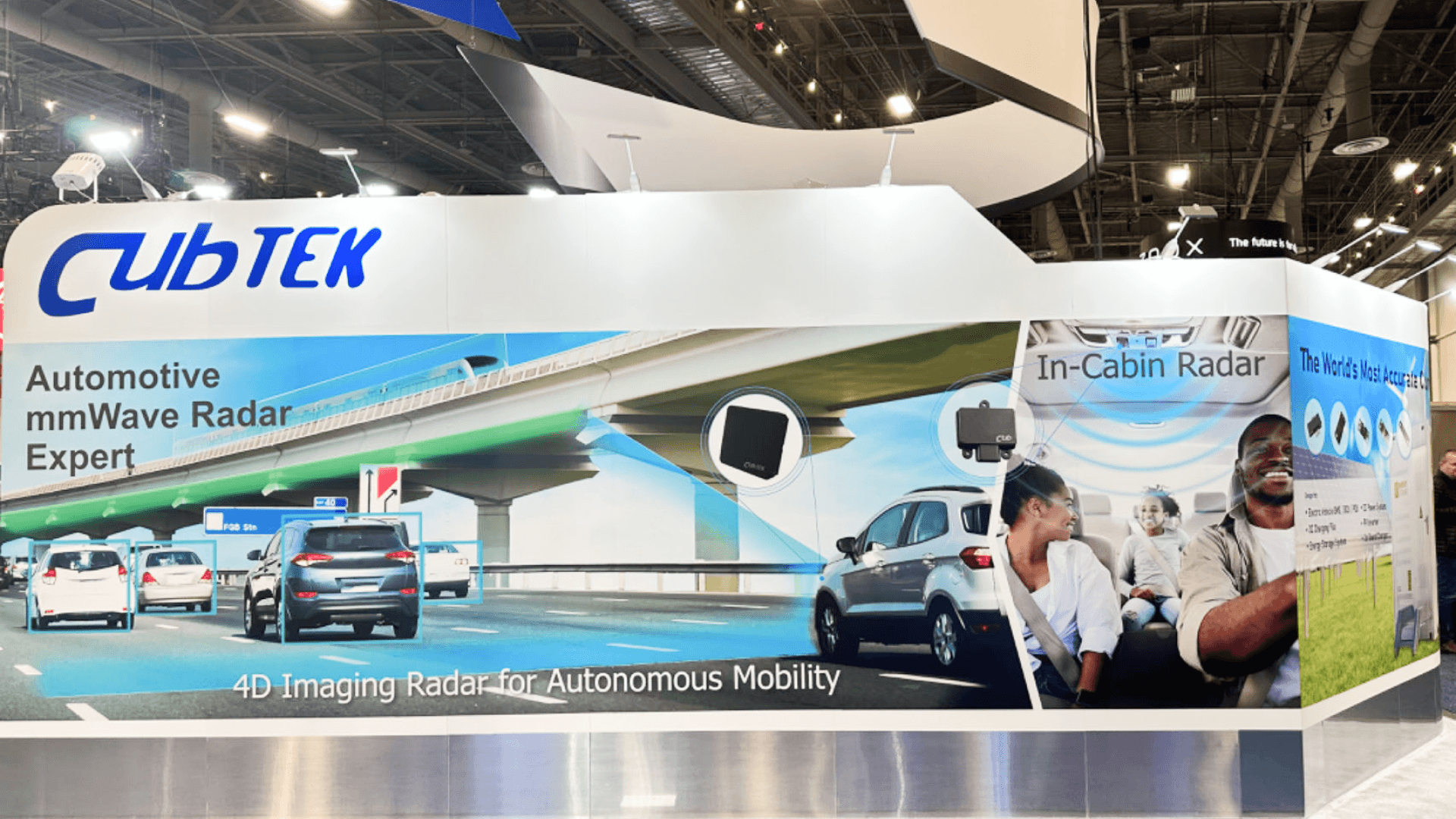 custom-built automotive testing exhibit booth with technical monitor wall and equipment-ready presentation area