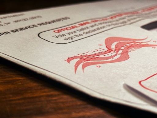 A close up of a piece of paper on a table illustrating th Permanent Residency France
