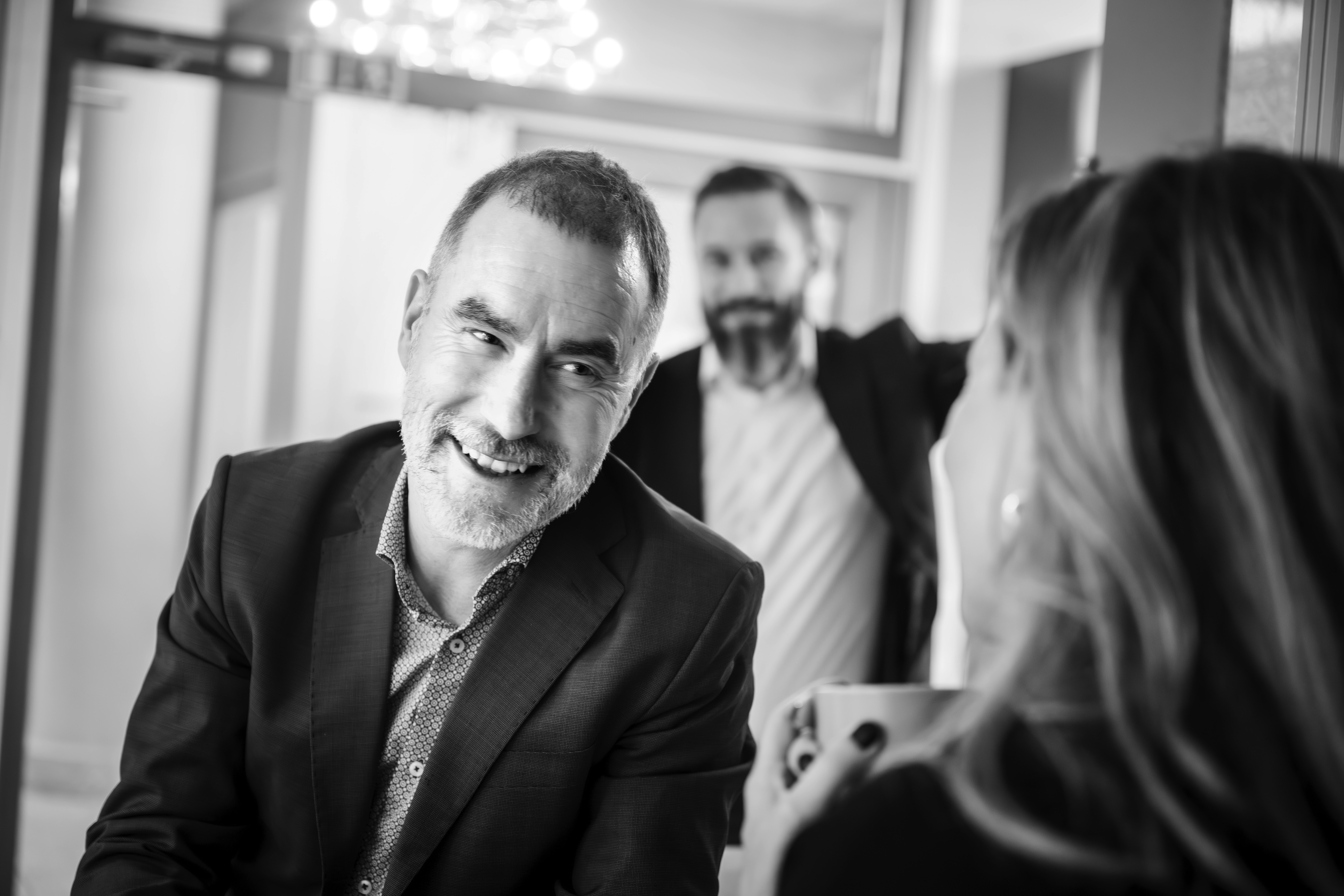 a man in a yellow shirt is on a red track