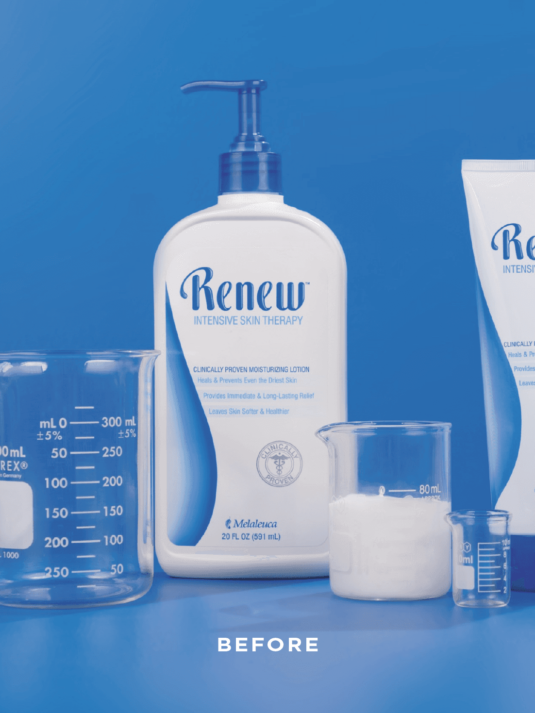 Modern home office setup with a monitor, ergonomic chair, keyboard, and indoor plants near a window with blinds.