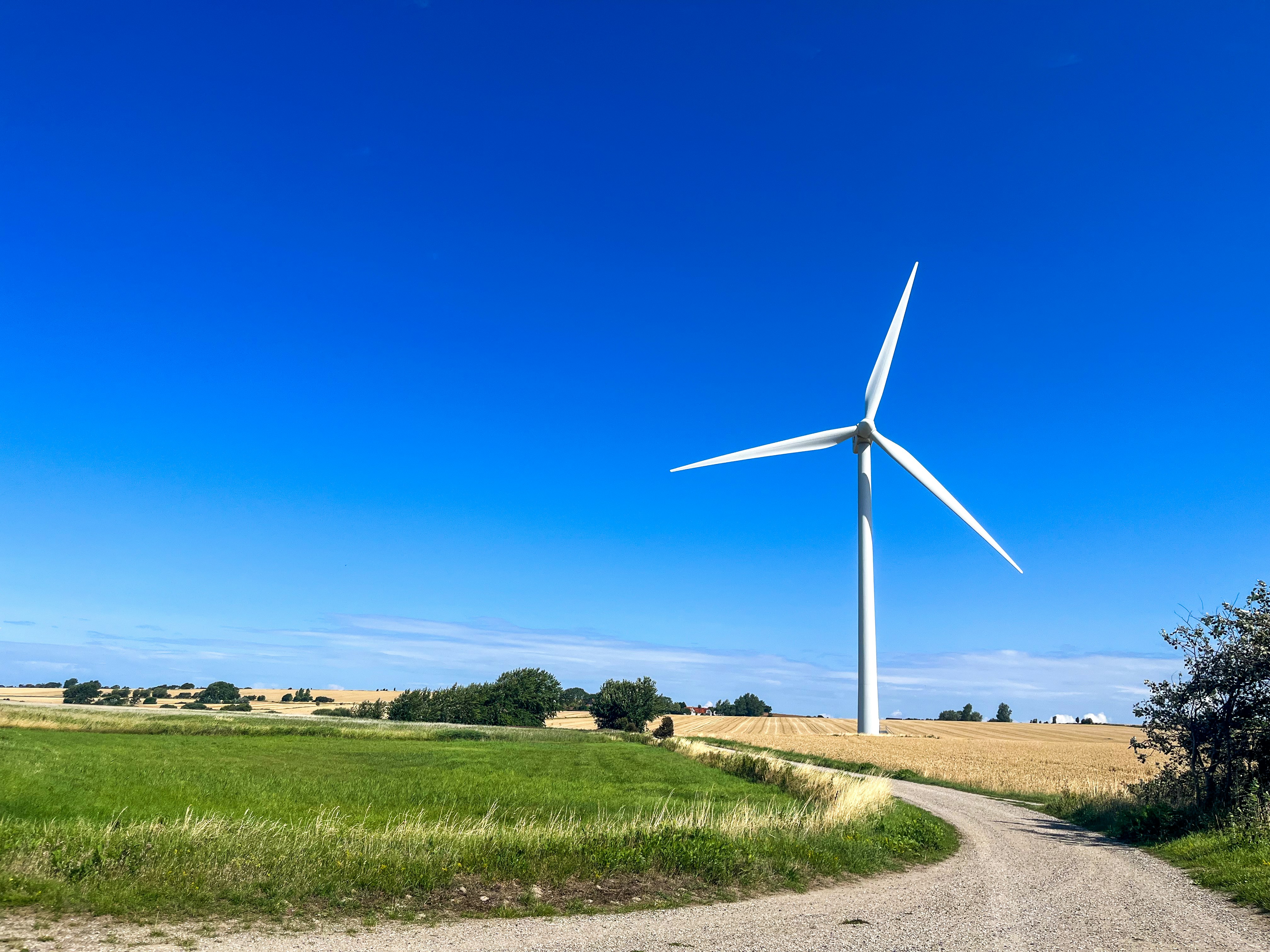 a wind turbine in the middle of a field