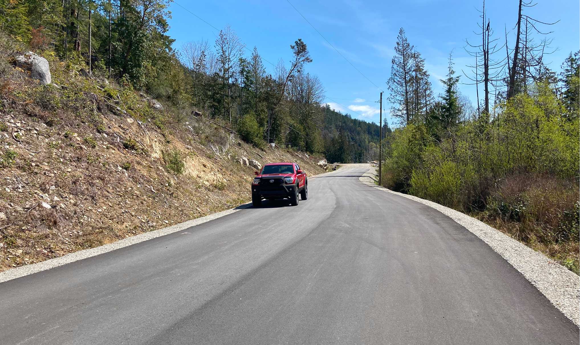 Completed subdivision road through Wood Bay Heights estate acreage development on Sunshine Coast BC