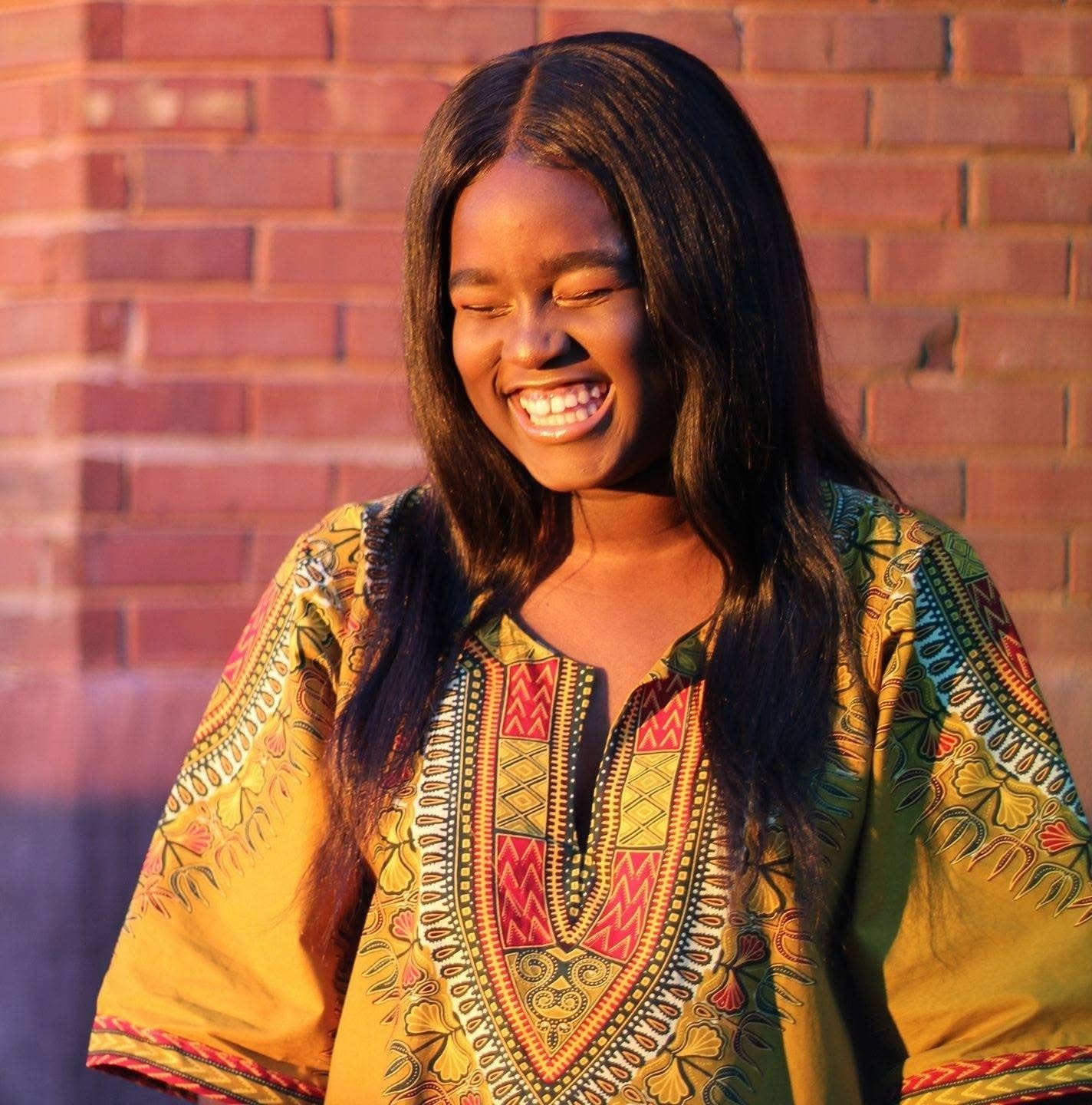 A young girl smiling