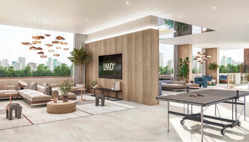 A modern living room featuring an open kitchen and dining area, showcasing contemporary design and furnishings.