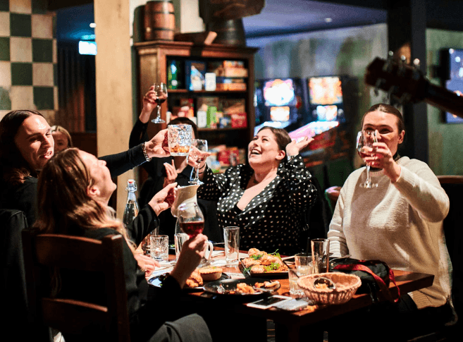 Groups of people playing on the computers in the Arena at Fortress