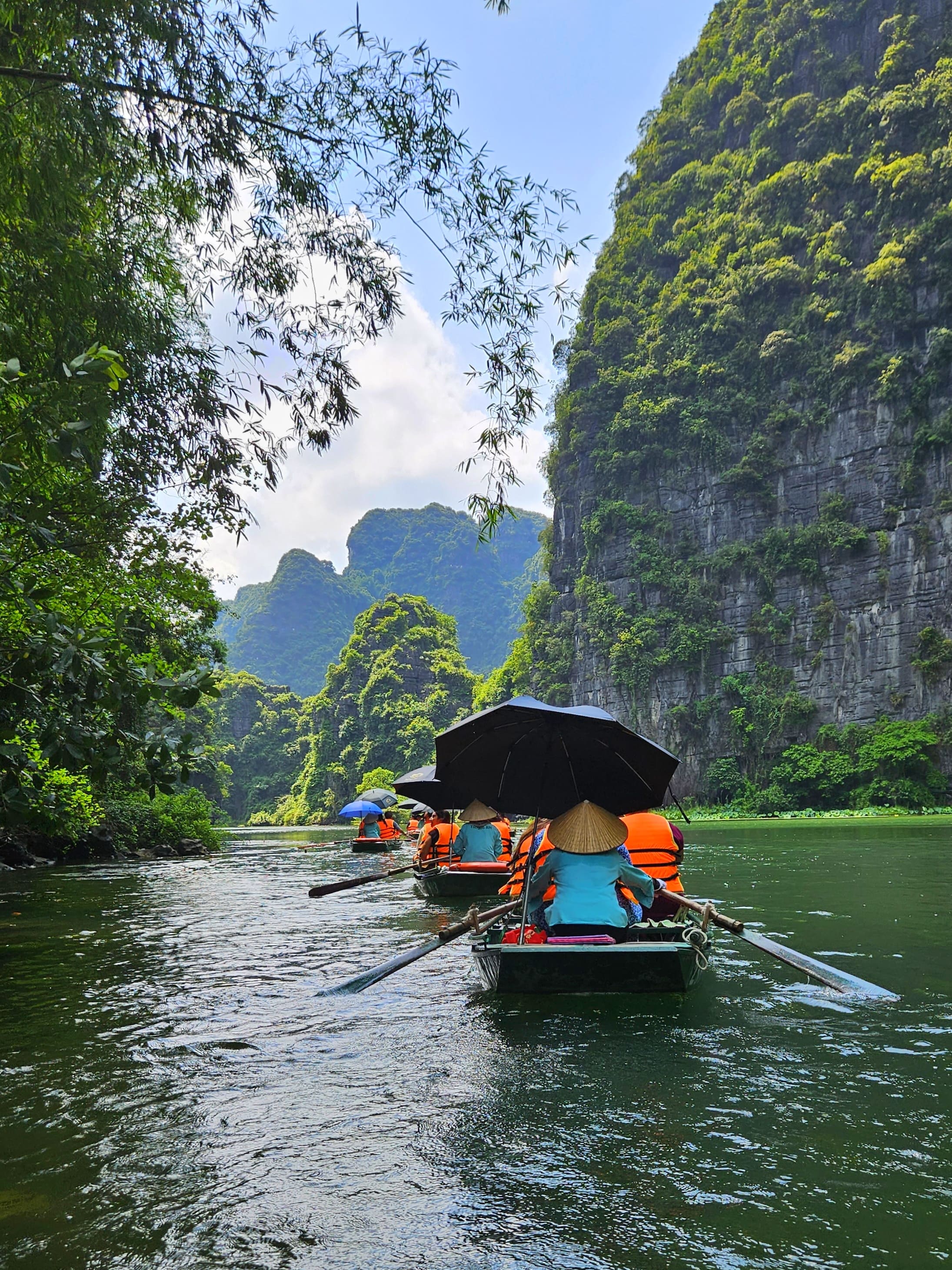 a person holding a small bowl of food