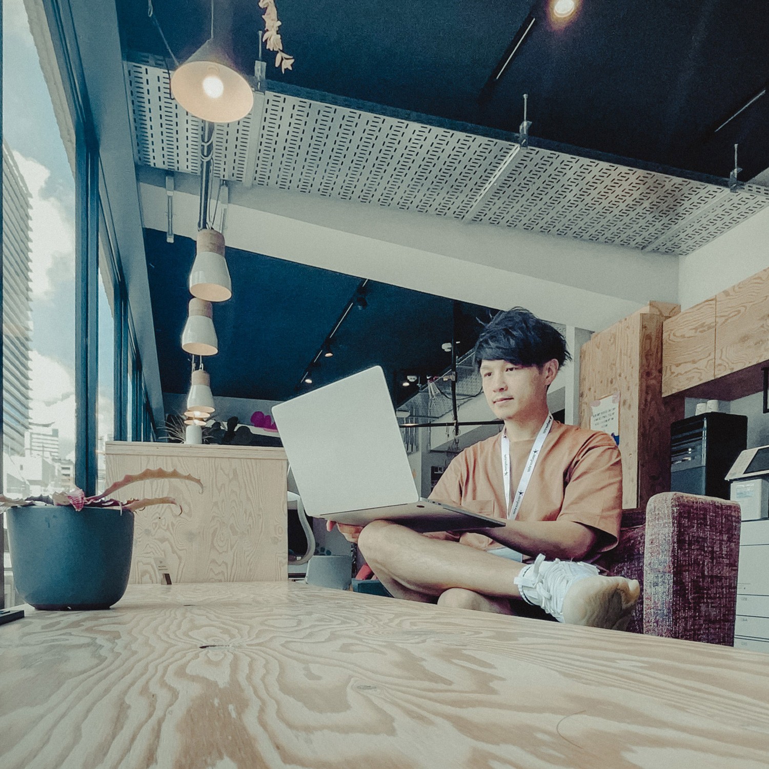 Interior of a cafe or workspace with several people at tables