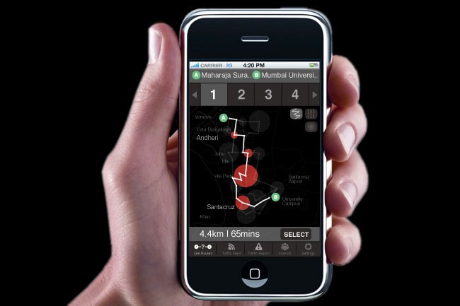 A hand holds a smartphone displaying a map application. The screen shows numbered points (1, 2, 3, 4) at the top, connected by white lines to a red circle in the center. Below the circle, labeled “A” and “B,” are locations: “Ventoso,” “Fori Dangeria,” and “Andheri.” A red circle marks the location labeled “University Campus.” The bottom of the screen displays “4.4km / 1.65mins” and “SELECT,” along with icons for offline maps, Wi-Fi, traffic, news, police, and settings. The time shown is 4:20 PM. The carrier is 3G, and the phone’s home button is visible at the bottom.