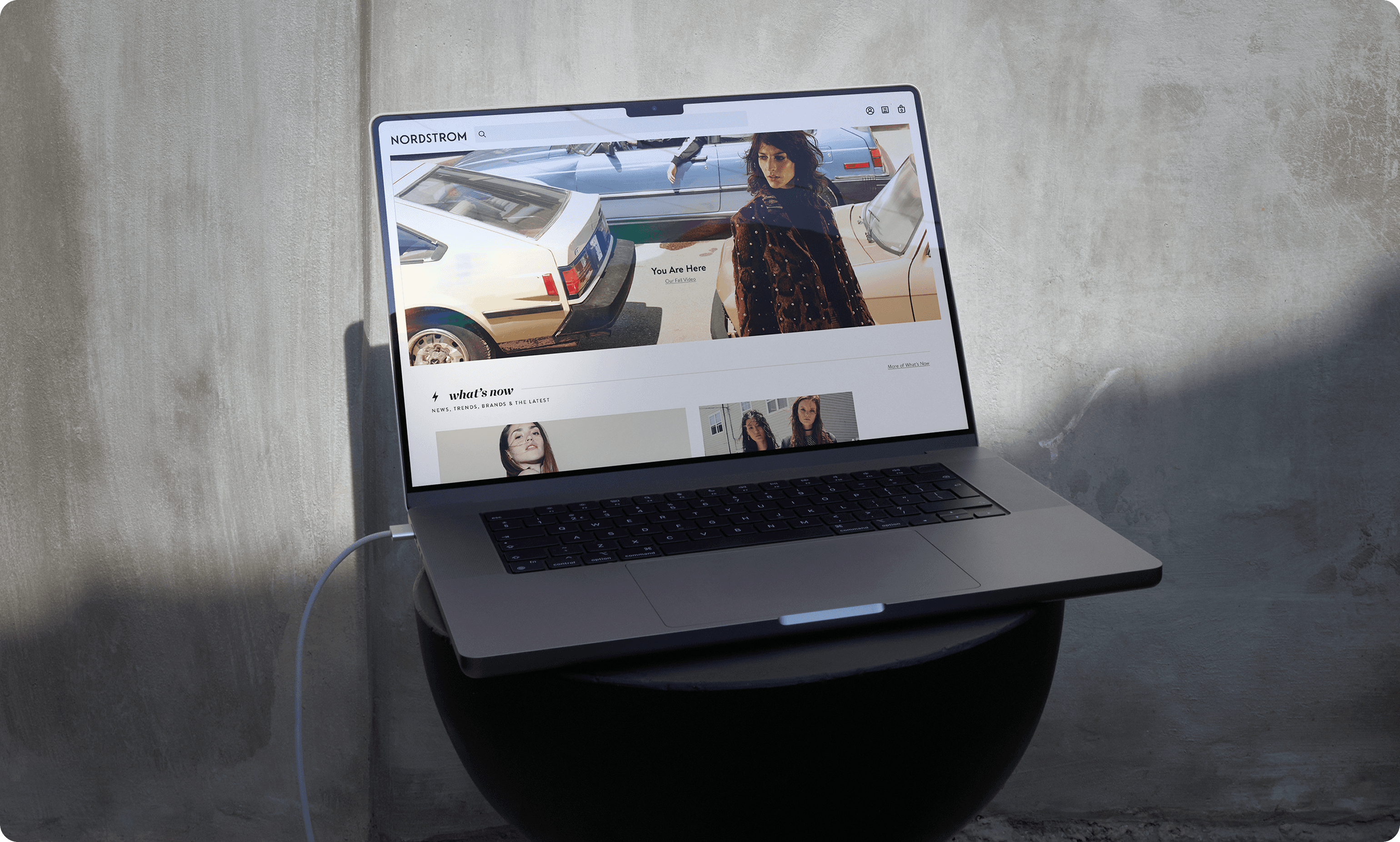 Luxurious modern bathroom featuring exposed brick accent wall, freestanding black bathtub, and marble-tiled walk-in shower