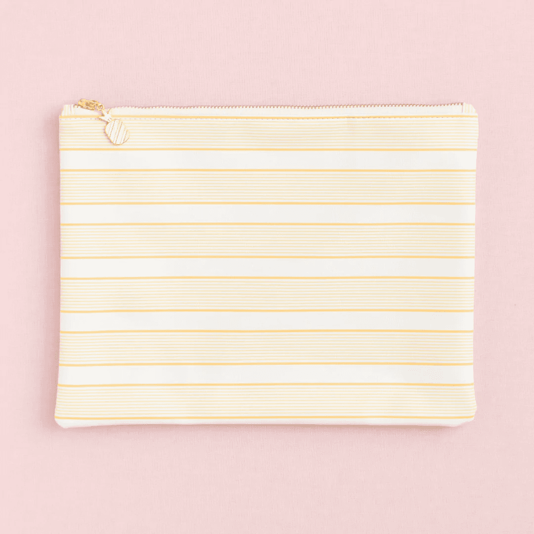 yellow striped pouch on a pink background