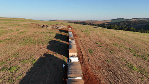 Picture of trucks moving along on a road
