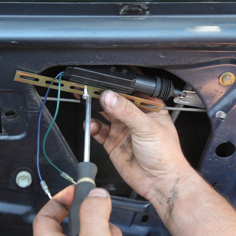 locking mechanism is being removed by a technician