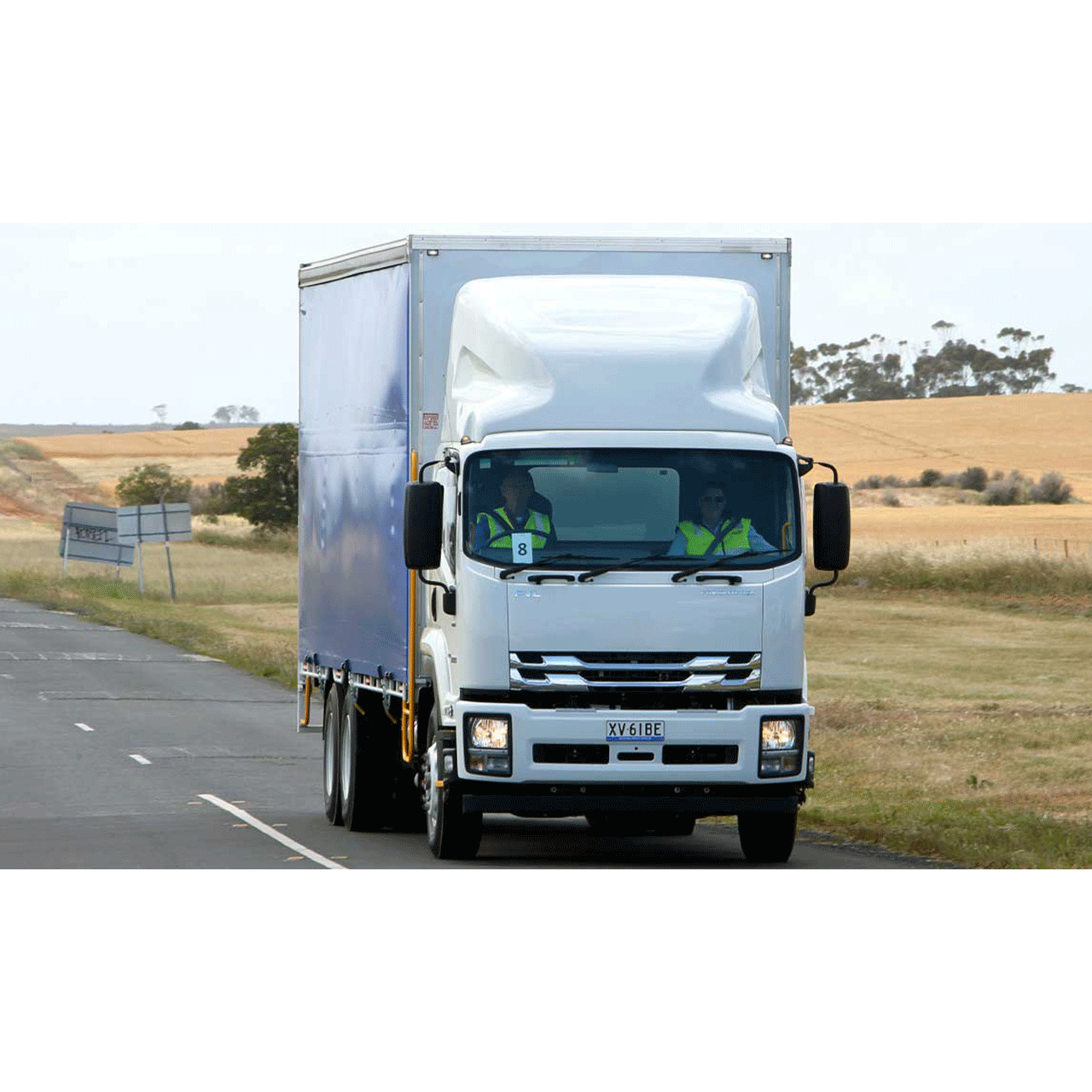 View of containers in motion at a large logistics hub located in a port.