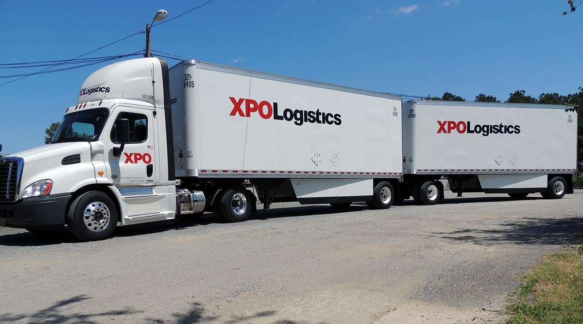 XPO Logistics double-articulated freight truck parked