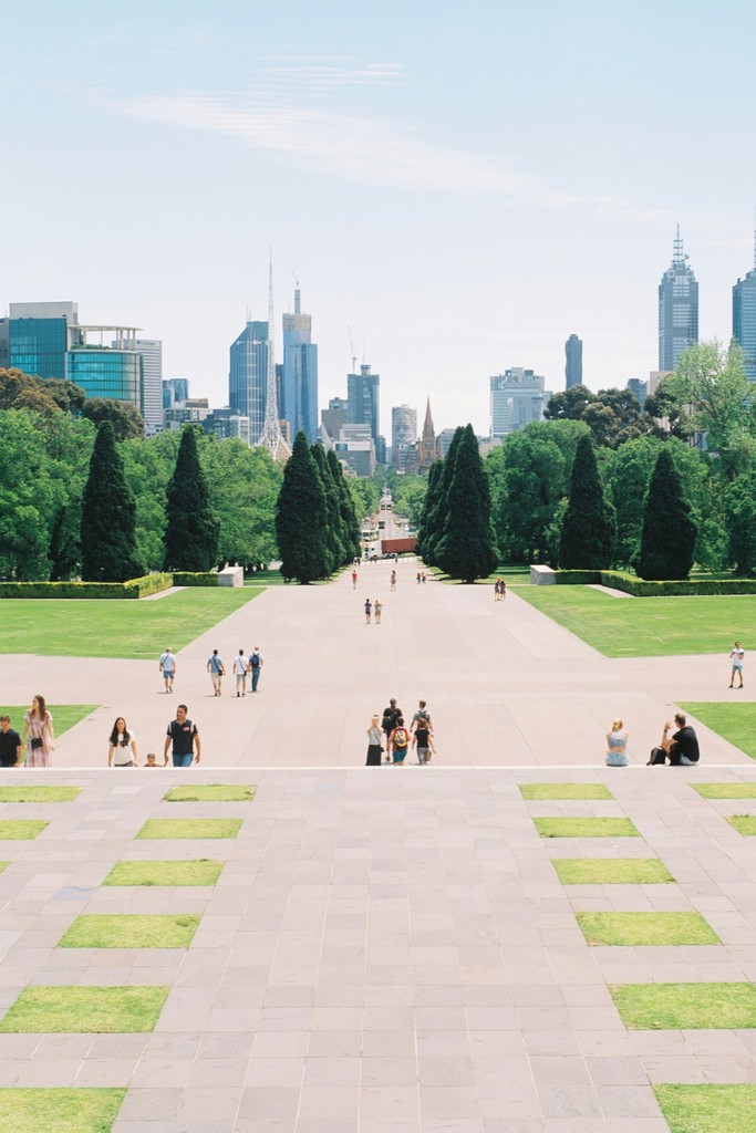 People walking in on the steps of the shrine of remembrance