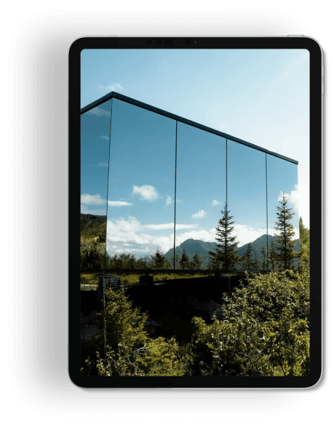 woman sitting around table holding tablet