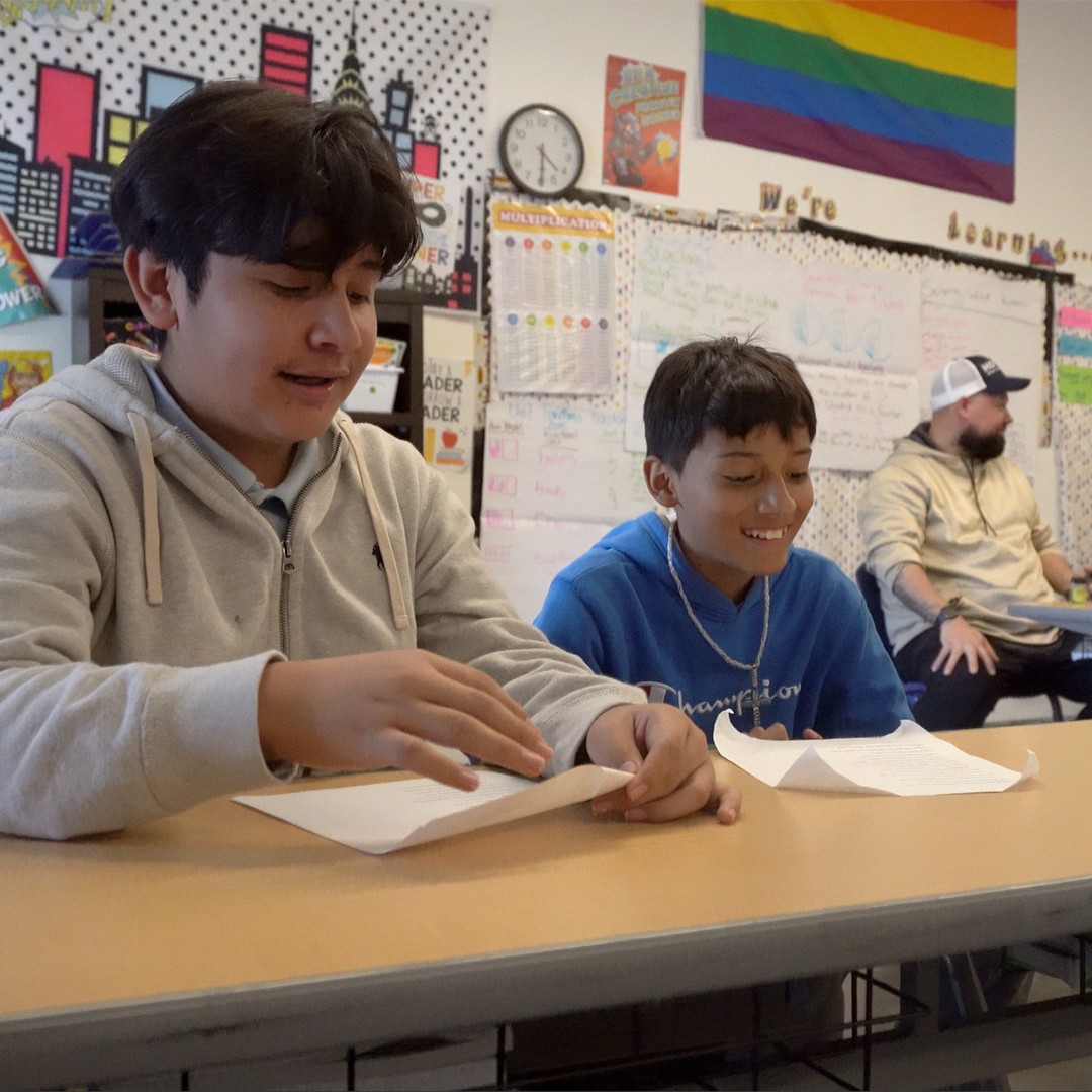 HOKALI aftercare students receiving homework support in a structured and supportive learning space.